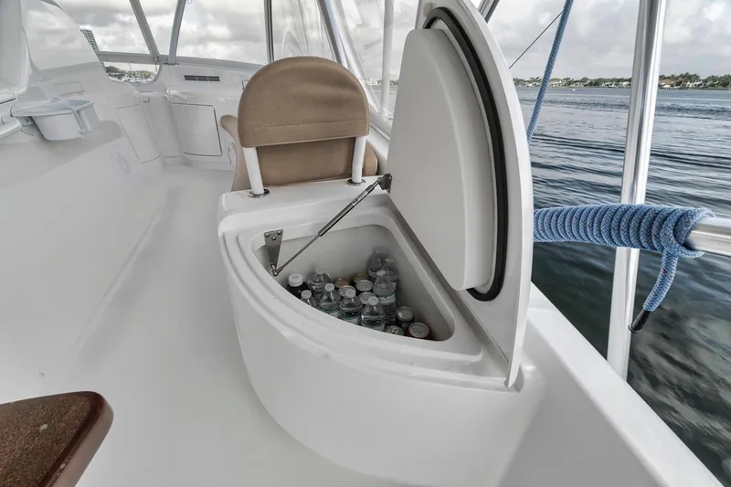 Slide: The Image of 2019 Viking 68 Convertible yacht with open cooler filled with drinks. - 48