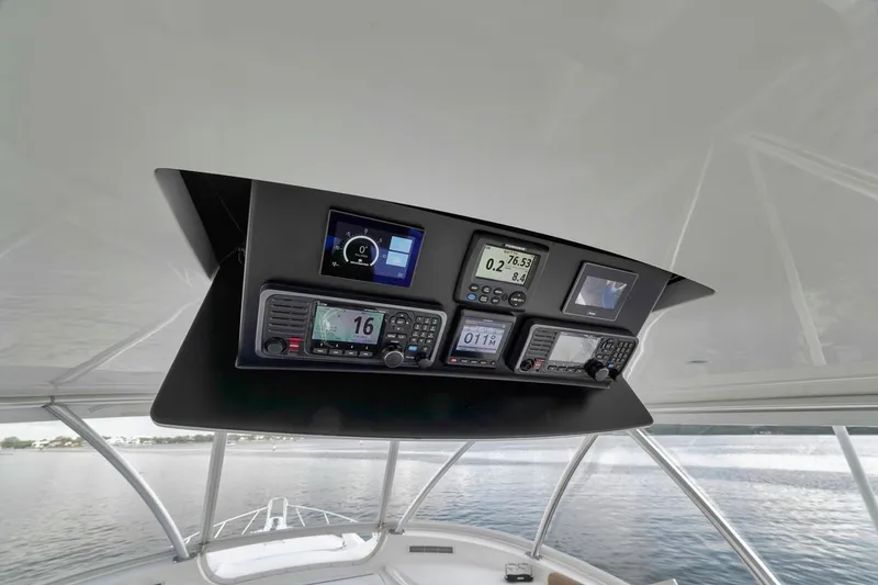 Slide: The Image of Control panel of 2019 Viking 68 Convertible yacht with navigation instruments. - 49