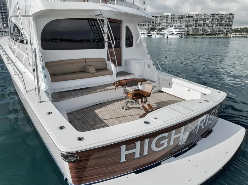 Slide: The Image of 2019 Viking 68 Convertible yacht with spacious deck and seating area. - 6