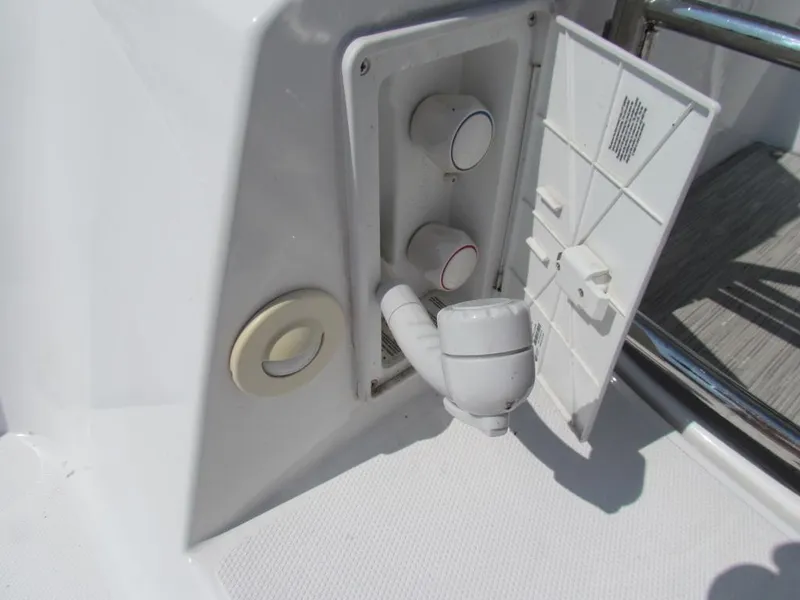 Slide: The Image of 2020 Cruisers Yachts 35 Express boat shower controls and hose detail. - 11