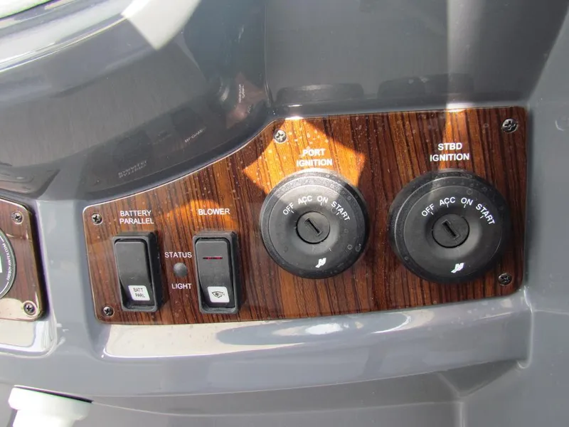 Slide: The Image of Control panel of 2020 Cruisers Yachts 35 Express with ignition switches and buttons. - 14