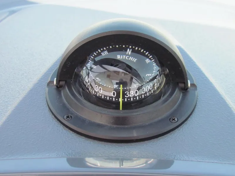 Slide: The Image of Compass on 2020 Cruisers Yachts 35 Express dashboard, showing navigation details. - 18