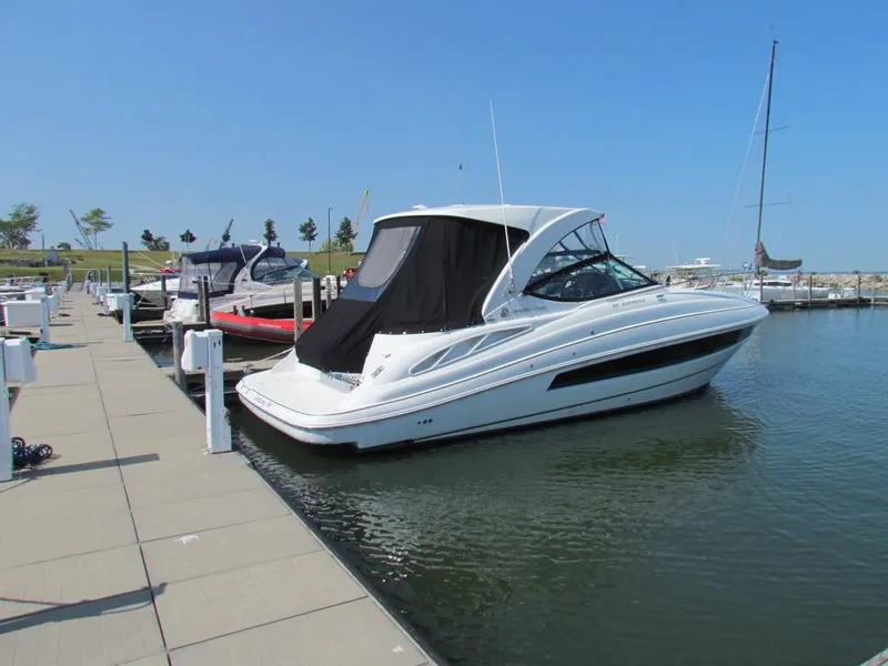 Slide: The Image of 2020 Cruisers Yachts 35 Express docked at marina under clear blue sky. - 20