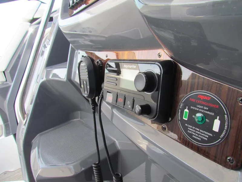 Slide: The Image of Control panel of 2020 Cruisers Yachts 35 Express with Raymarine system and fire extinguisher indicator. - 31