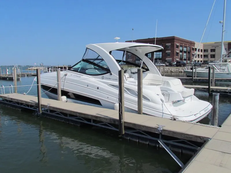 Slide: The Image of 2020 Cruisers Yachts 35 Express docked at marina, sunny day, clear blue sky. - 35