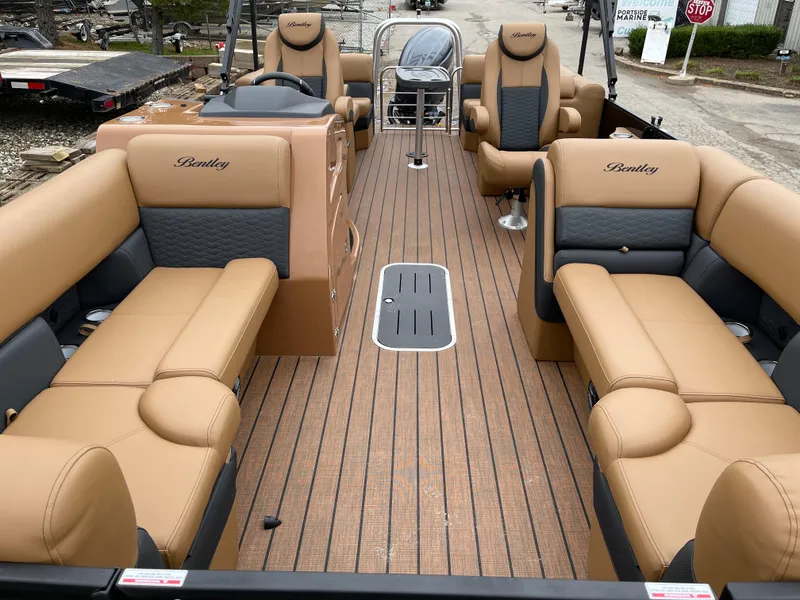 Slide: The Image of 2025 Bentley Pontoons Elite 223 Admiral with luxurious tan seating and sleek deck design. - 10