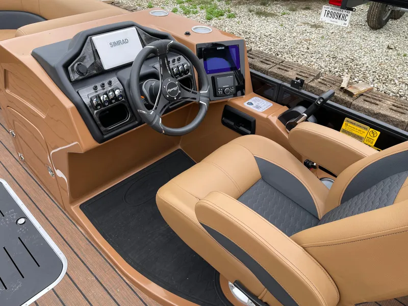 Slide: The Image of 2025 Bentley Pontoons Elite 223 Admiral dashboard with steering wheel and control panel. - 7