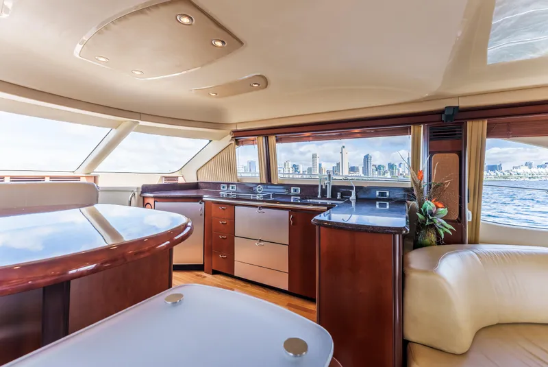 Slide: The Image of Luxurious interior of a 2005 Sea Ray 550 Sedan Bridge yacht with city skyline view. - 13