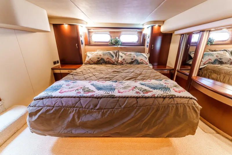 Slide: The Image of Luxurious bedroom interior of 2005 Sea Ray 550 Sedan Bridge yacht. - 16