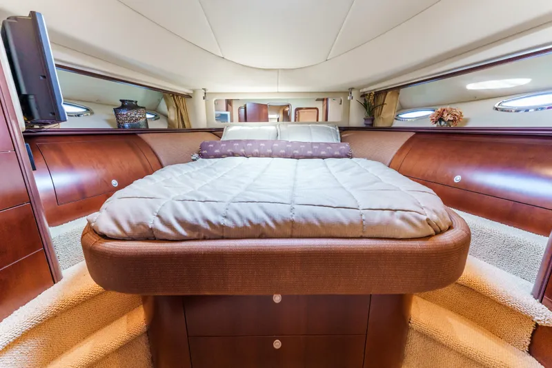 Slide: The Image of Luxurious 2005 Sea Ray 550 Sedan Bridge yacht bedroom with elegant wood finishes. - 20