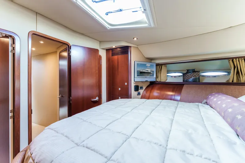 Slide: The Image of Luxurious bedroom interior of 2005 Sea Ray 550 Sedan Bridge yacht. - 21