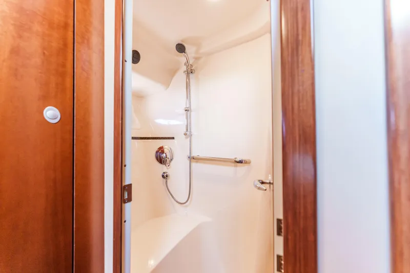 Slide: The Image of Luxurious shower in 2005 Sea Ray 550 Sedan Bridge yacht, featuring sleek design and modern fixtures. - 23