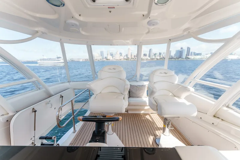 Slide: The Image of Interior of 2005 Sea Ray 550 Sedan Bridge yacht with city skyline view. - 4