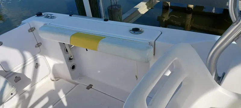 Slide: The Image of 2006 Pro-Line 24 Walk boat interior with seating and rod holders. - 12