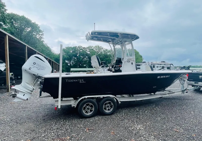 Slide: The Image of 2021 Tidewater 2500 Carolina Bay boat on trailer, parked outdoors. - 1
