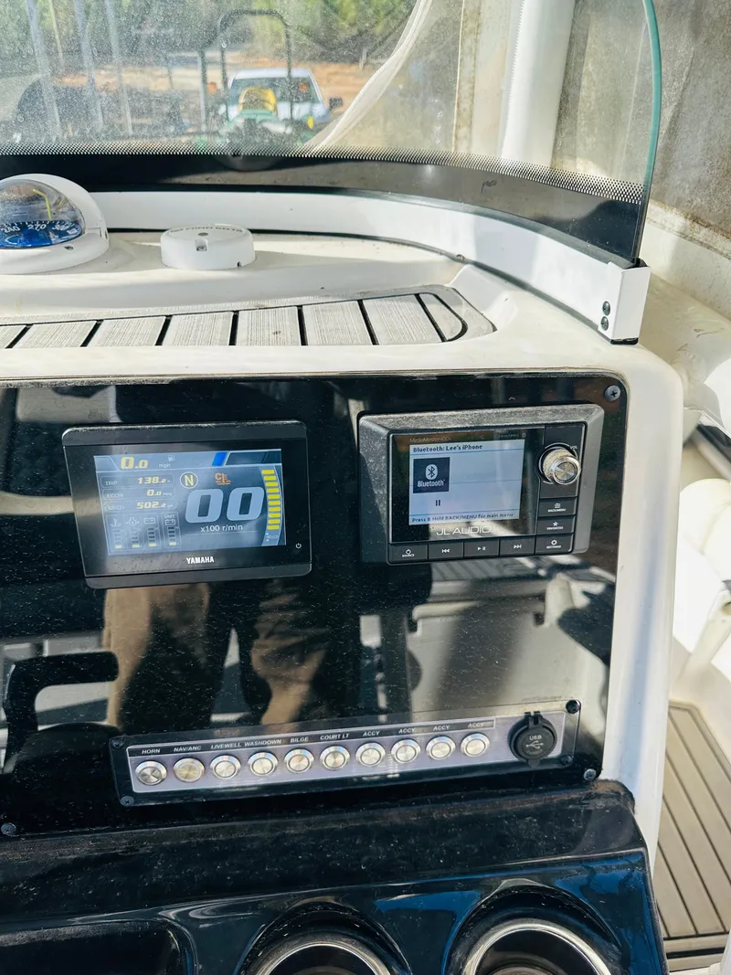 Slide: The Image of Control panel of 2021 Tidewater 2500 Carolina Bay boat with digital displays. - 8