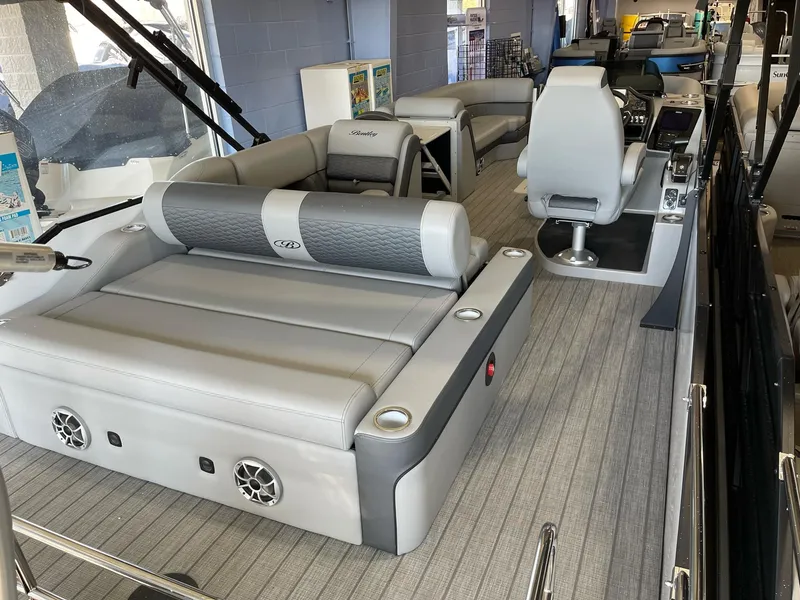 Slide: The Image of 2025 Bentley Pontoons Elite 253 Swingback interior with luxurious seating and modern design. - 12
