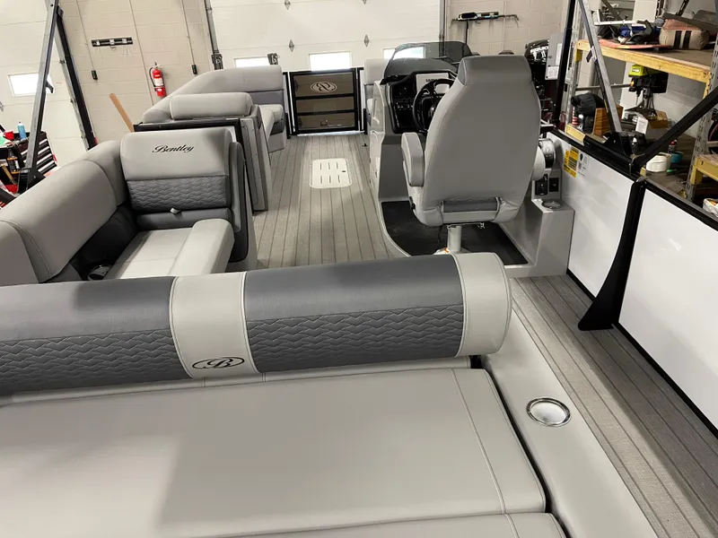 Slide: The Image of 2025 Bentley Pontoons Elite 253 Swingback interior with luxurious seating and modern design. - 6