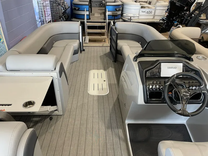 Slide: The Image of 2025 Bentley Pontoons Elite 253 Swingback interior with modern seating and steering console. - 9