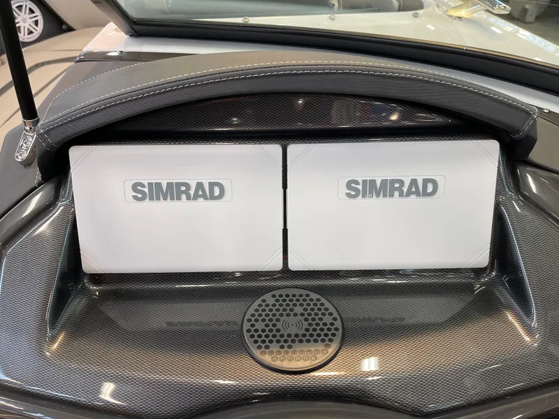 Slide: The Image of Simrad navigation displays on 2025 Monterey 218 SS boat dashboard. - 11
