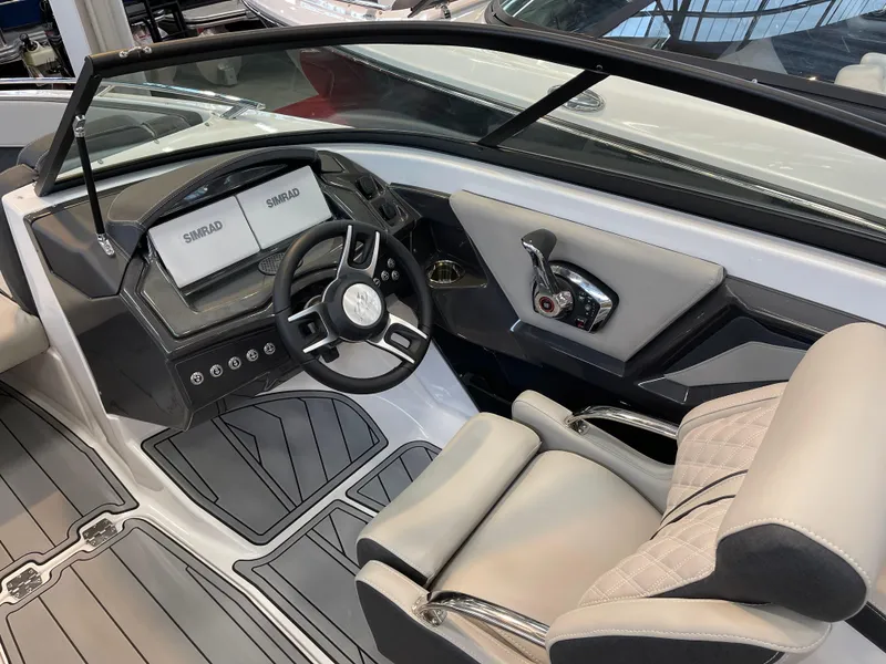 Slide: The Image of 2025 Monterey 218 SS boat interior with modern dashboard and steering wheel. - 7