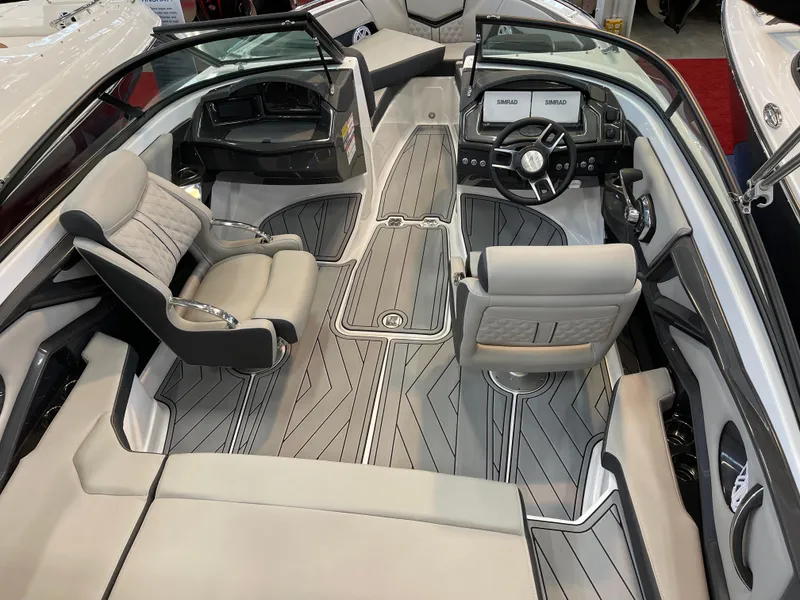 Slide: The Image of 2025 Monterey 218 SS boat interior with modern seating and sleek dashboard design. - 9