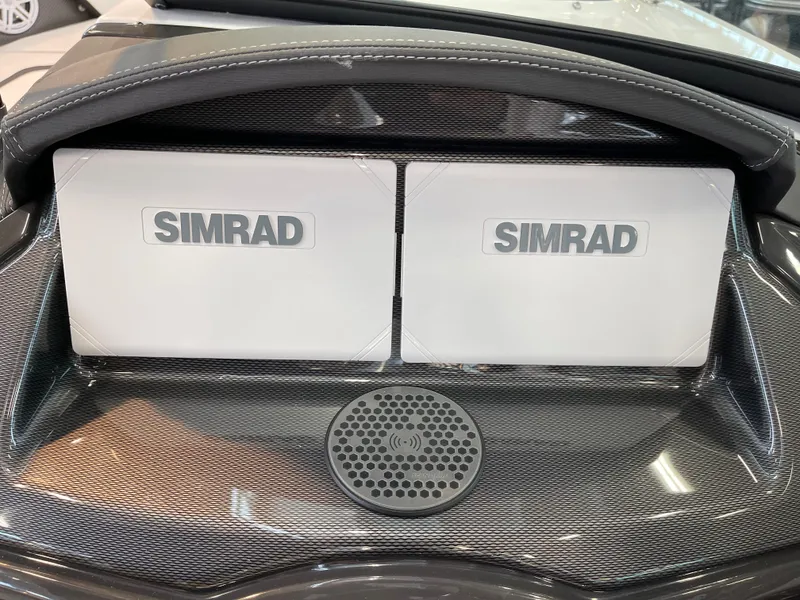 Slide: The Image of Simrad navigation displays on 2025 Monterey 238 SS boat dashboard. - 11