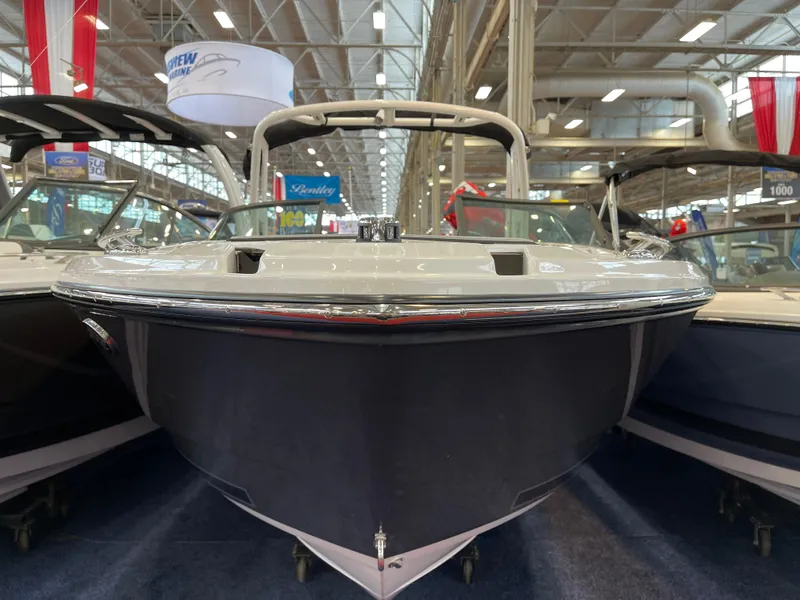 Slide: The Image of 2025 Monterey 238 SS boat displayed at an indoor exhibition, showcasing sleek design and modern features. - 3