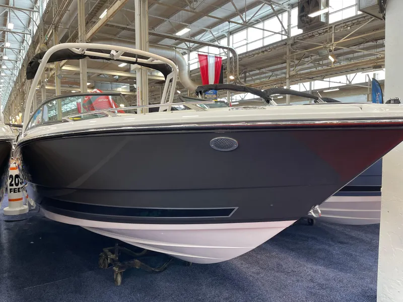 Slide: The Image of 2025 Monterey 238 SS boat displayed indoors, showcasing sleek design and modern features. - 4