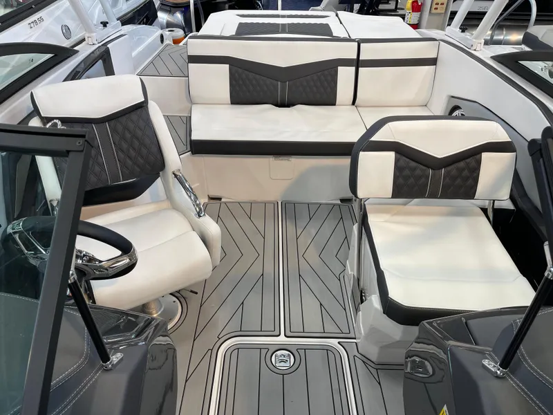 Slide: The Image of 2025 Monterey 238 SS boat interior with modern seating and sleek design. - 9