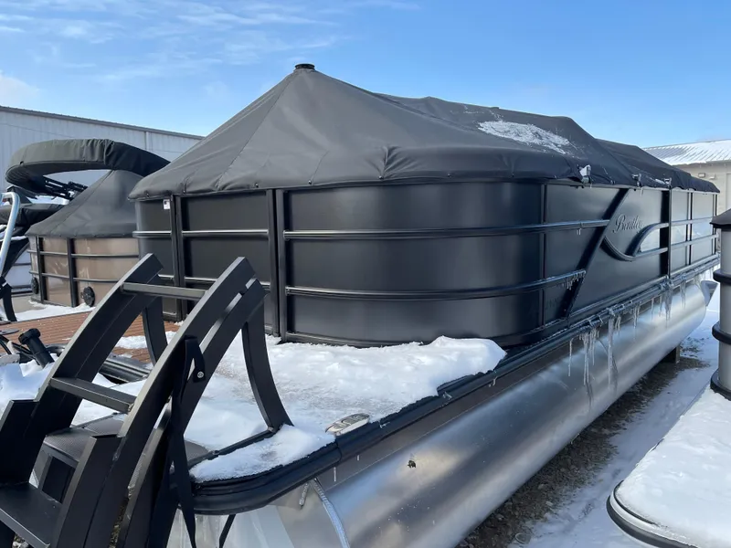 Slide: The Image of 2025 Bentley Pontoons Legacy 223 Navigator covered in snow, parked outdoors. - 3