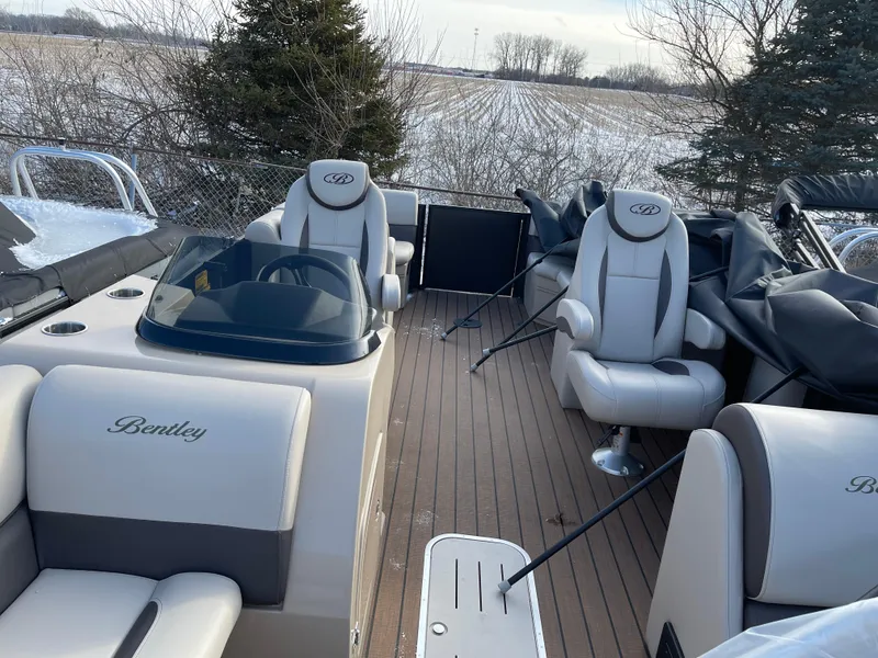 Slide: The Image of 2025 Bentley Pontoons Legacy 223 Navigator with luxurious seating and sleek design. - 4