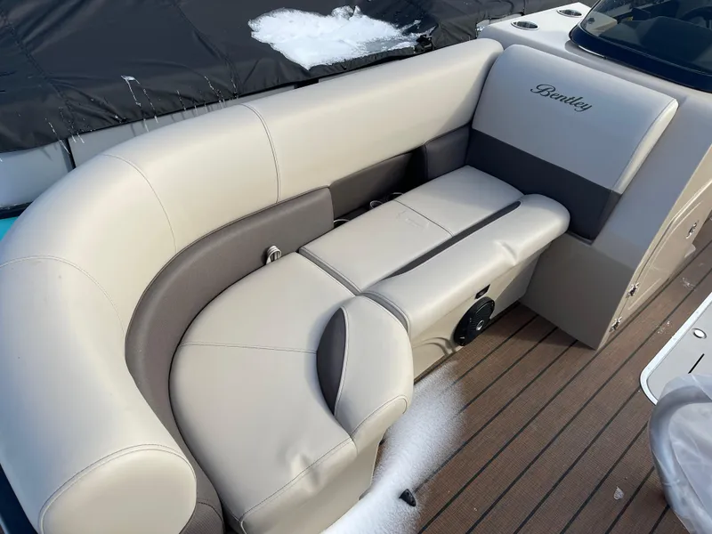 Slide: The Image of 2025 Bentley Pontoons Legacy 223 Navigator interior seating with beige upholstery. - 6