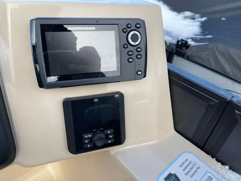 Slide: The Image of Control panel of 2025 Bentley Pontoons Legacy 223 Navigator with Humminbird display. - 9