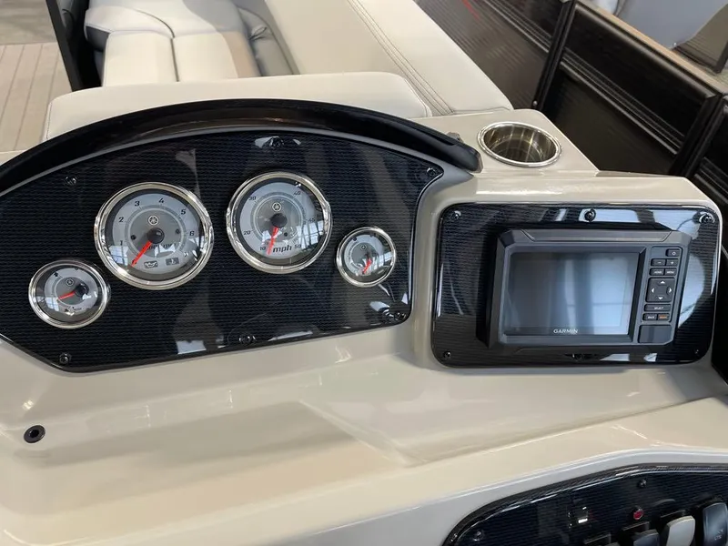 Slide: The Image of Dashboard of 2025 SunCatcher Select 322RC boat with gauges and display screen. - 10