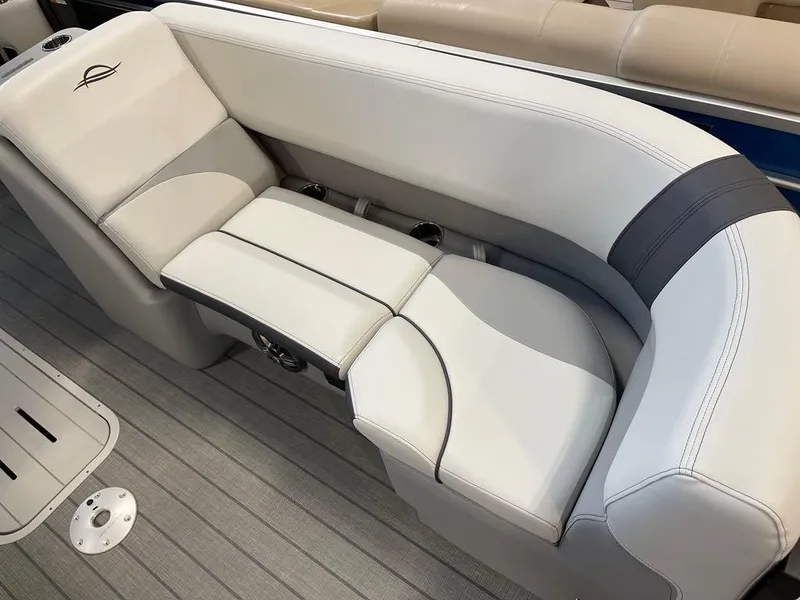 Slide: The Image of 2025 SunCatcher Select 322RC boat seating with elegant gray and white upholstery. - 3