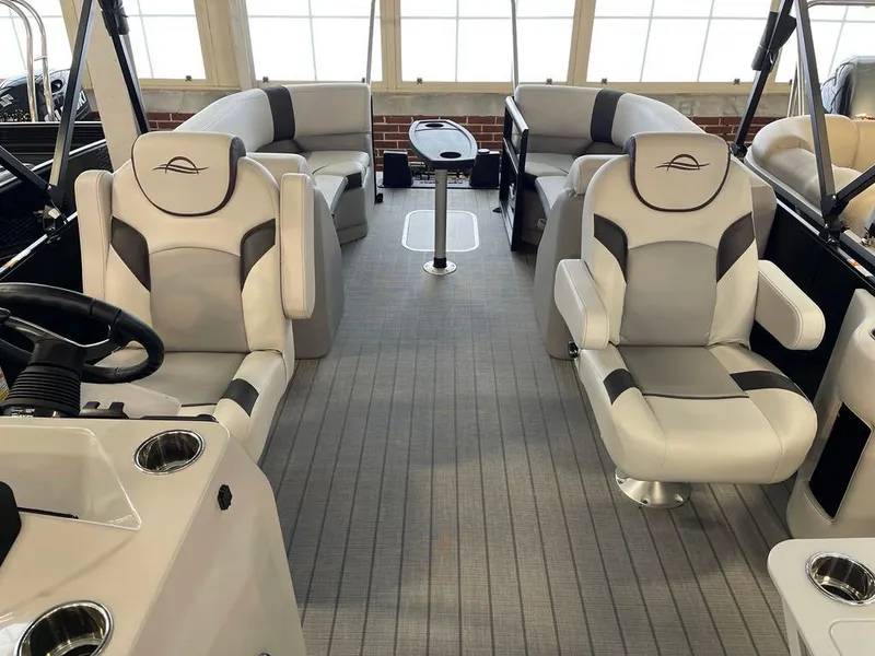 Slide: The Image of 2025 SunCatcher Select 322RC boat interior with luxurious seating and modern design. - 6
