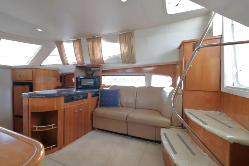 Slide: The Image of Interior of 2002 Carver 346 Motor Yacht with sofa and kitchen. - 14