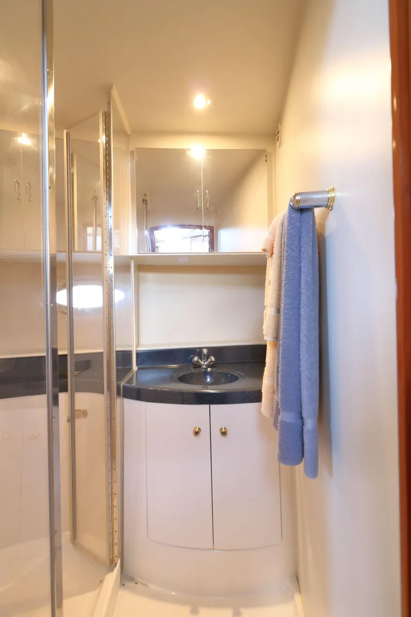 Slide: The Image of 2002 Carver 346 Motor Yacht bathroom with mirror and towel. - 22