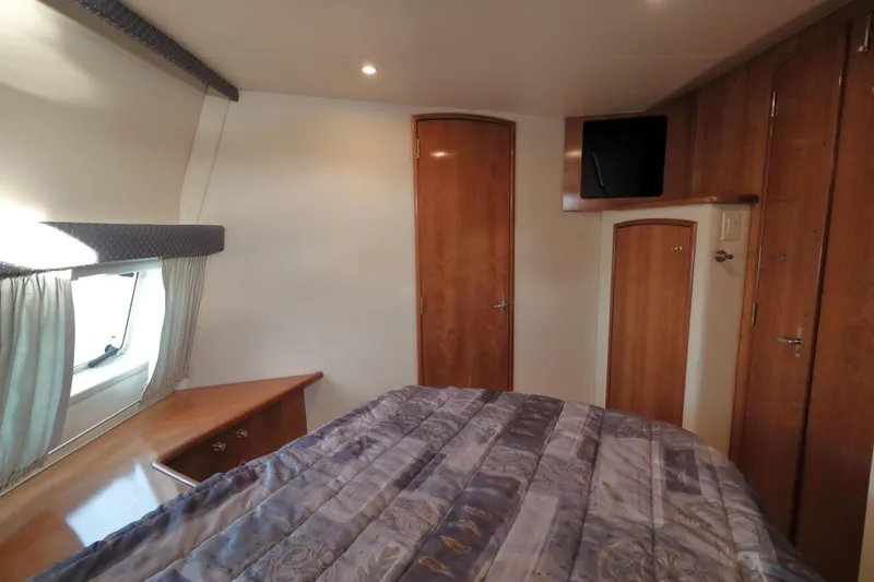 Slide: The Image of Interior of 2002 Carver 346 Motor Yacht with cozy bedroom. - 26