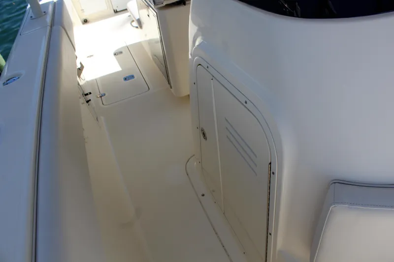 Slide: The Image of 2008 Pursuit S 310 Sport boat deck with storage compartment. - 22