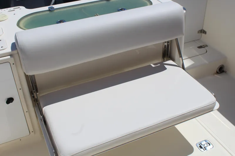 Slide: The Image of 2008 Pursuit S 310 Sport boat with cushioned seating and livewell. - 25