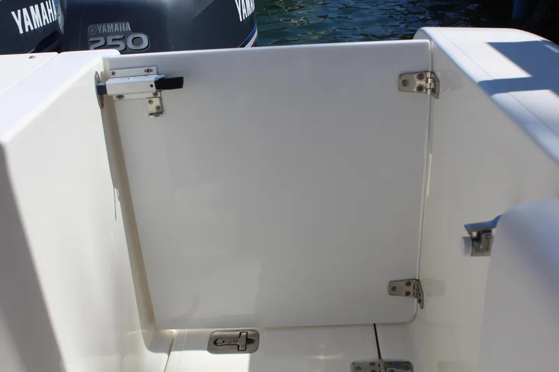 Slide: The Image of 2008 Pursuit S 310 Sport boat with Yamaha 250 engine, featuring a white deck gate. - 26