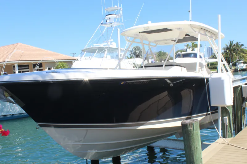 Slide: The Image of 2008 Pursuit S 310 Sport boat docked in sunny marina. - 7