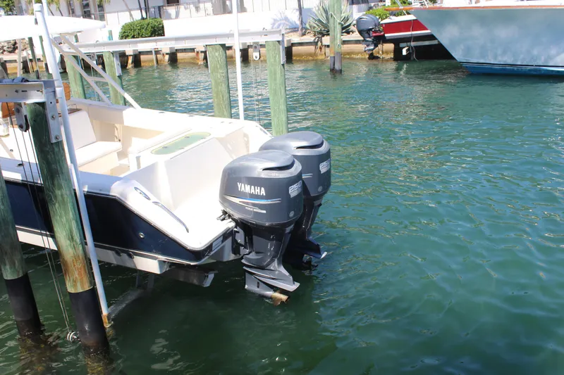 Slide: The Image of 2008 Pursuit S 310 Sport boat with twin Yamaha outboard motors docked in marina. - 9