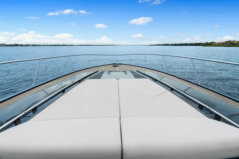 Slide: The Image of 2015 Riva 63 Virtus yacht deck with serene water view. - 10