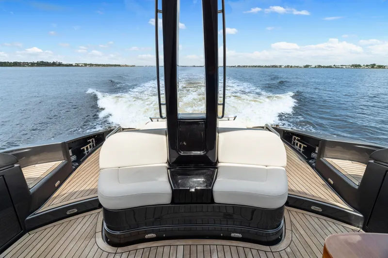 Slide: The Image of 2015 Riva 63 Virtus yacht cruising on open water, showcasing elegant deck design. - 14