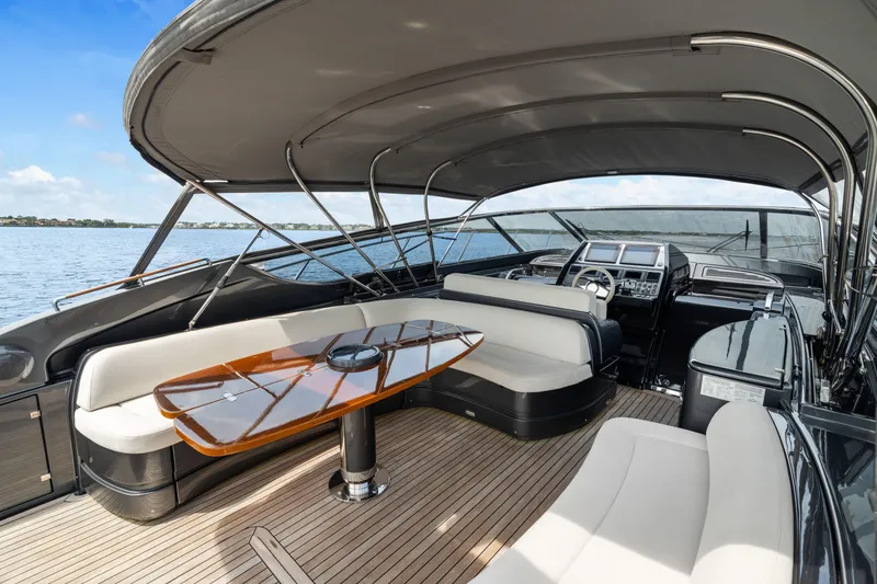 Slide: The Image of Luxurious 2015 Riva 63 Virtus yacht interior with elegant seating and sleek design. - 17