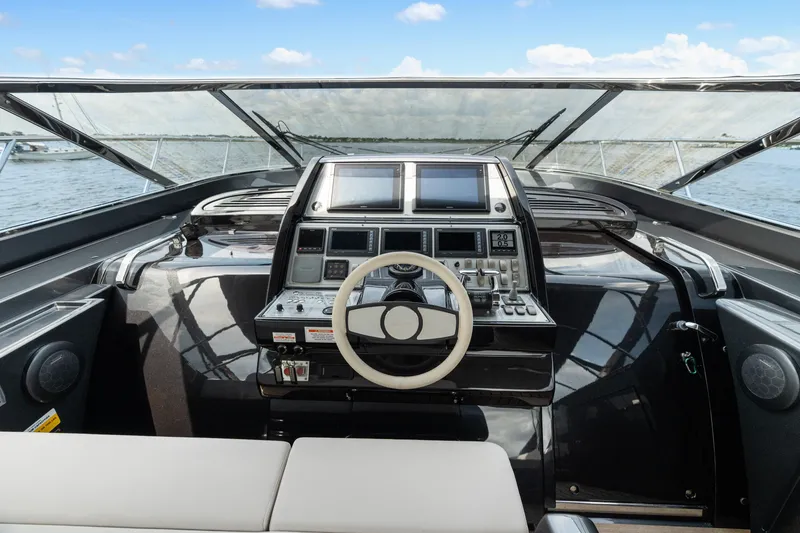 Slide: The Image of Cockpit of 2015 Riva 63 Virtus yacht with modern controls and steering wheel. - 19