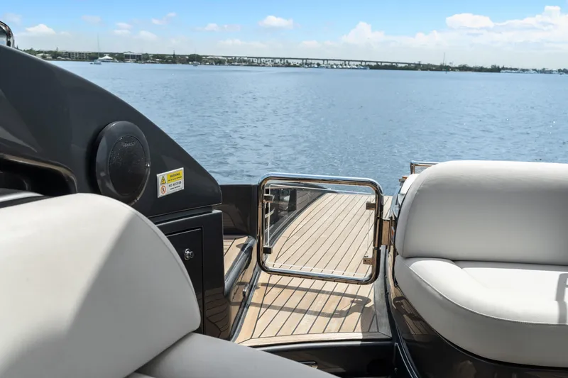 Slide: The Image of Luxurious 2015 Riva 63 Virtus yacht deck with serene ocean view. - 22
